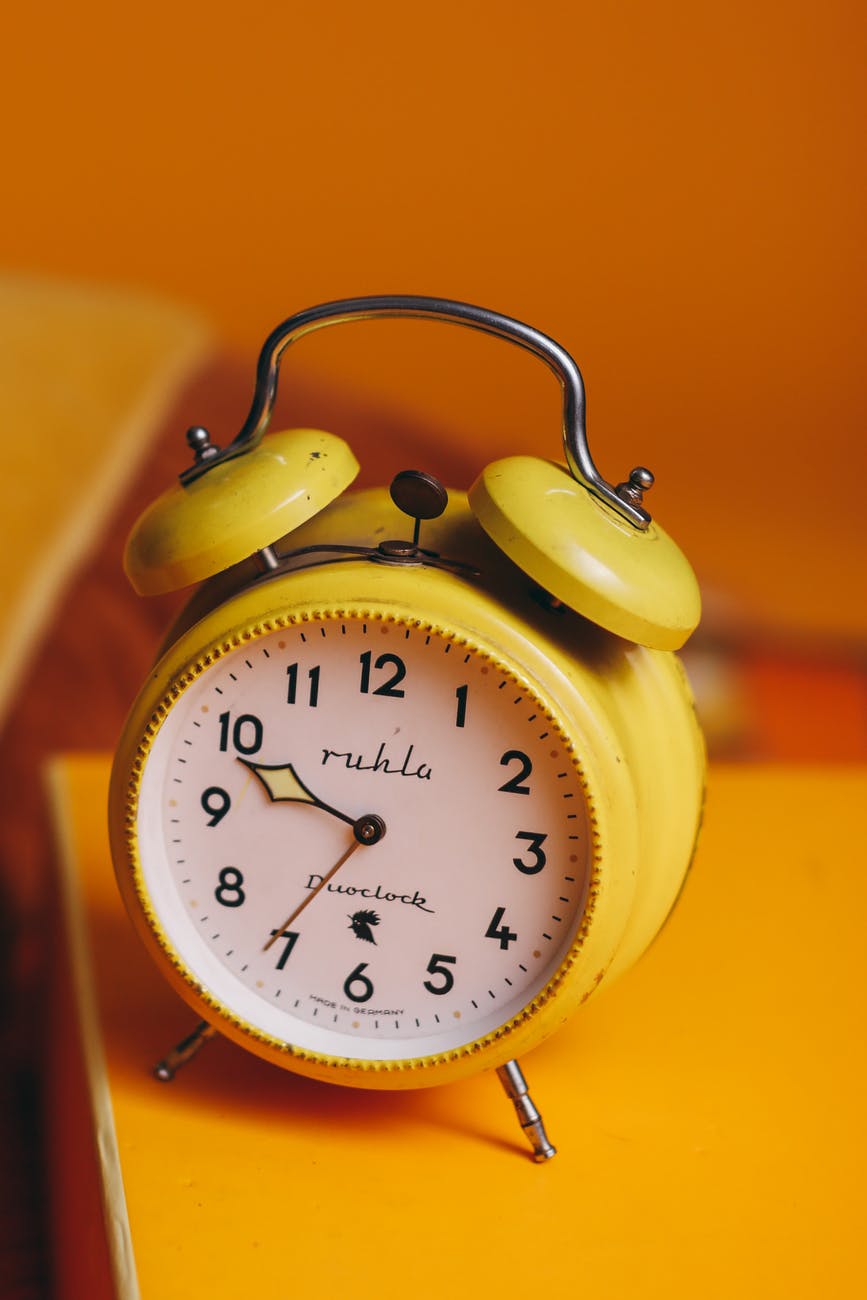 yellow and white alarm clock