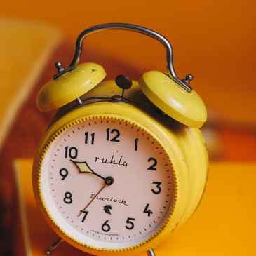 yellow and white alarm clock